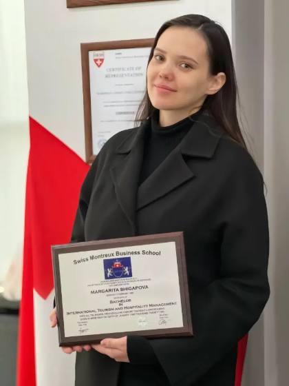 SMBS graduate with diploma