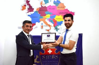 SMBS graduate with diploma