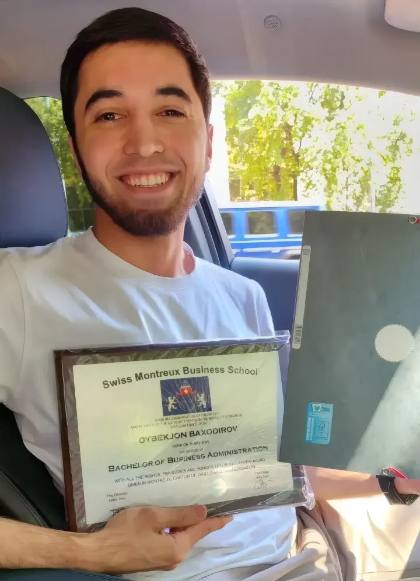SMBS graduate with diploma