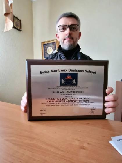 SMBS graduate with diploma