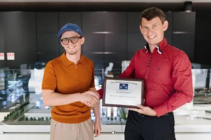 SMBS graduate with diploma